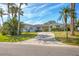 Charming single story home with a curved driveway and lush tropical landscaping in a beautiful setting at 1220 Lakeside Dr, Venice, FL 34293