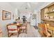 Bright kitchen showcasing white cabinetry, appliances and tile flooring with a view to the dining area at 1220 Lakeside Dr, Venice, FL 34293