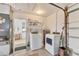 Functional laundry area with new washer and dryer, and lots of storage space at 1220 Lakeside Dr, Venice, FL 34293