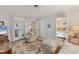 Bright living room with comfortable furniture, a doorway, and neutral decor at 1220 Lakeside Dr, Venice, FL 34293