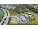 Aerial view features pool, clubhouse, parking, playground, and a dog park in the community at 12637 Promenade Estates Blvd, Sarasota, FL 34238