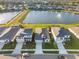 Aerial view showcasing the home and nearby lakes in a Gathering-friendly community at 12637 Promenade Estates Blvd, Sarasota, FL 34238
