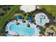 Overhead shot showcasing the community pool, splash pad, and playground amenities at 12637 Promenade Estates Blvd, Sarasota, FL 34238