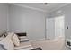 This bedroom has a trundle daybed and a door to another bedroom at 12637 Promenade Estates Blvd, Sarasota, FL 34238