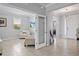 A bright living room extends into the entry area of the home at 12637 Promenade Estates Blvd, Sarasota, FL 34238