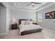 Tranquil main bedroom with tray ceiling, plantation shutters, and neutral décor at 12637 Promenade Estates Blvd, Sarasota, FL 34238