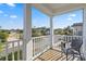 Balcony with white railing, porch and views of the neighborhood at 12679 Sagewood Dr, Venice, FL 34293