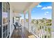 Charming porch with white railings, providing neighborhood views at 12679 Sagewood Dr, Venice, FL 34293