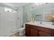 Bathroom with a walk-in shower, vanity with storage, and nautical decor at 12679 Sagewood Dr, Venice, FL 34293