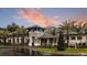 Elegant clubhouse with stone accents, lush landscaping, and a serene atmosphere perfect for social gatherings at 12679 Sagewood Dr, Venice, FL 34293