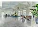 Spacious community room with modern decor, ample seating, and abundant natural light from large windows at 12679 Sagewood Dr, Venice, FL 34293
