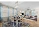 Bright and open dining room with stylish decor, and view of kitchen and living area at 12679 Sagewood Dr, Venice, FL 34293