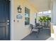 Inviting front porch with seating, perfect for enjoying the outdoors at 12679 Sagewood Dr, Venice, FL 34293