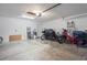 Spacious garage with epoxy flooring and ample space for parking and storage at 12679 Sagewood Dr, Venice, FL 34293