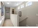 Bright hallway with carpeted floors, clerestory windows and neutral paint at 12679 Sagewood Dr, Venice, FL 34293