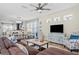 Open-concept living room with dining area featuring stylish furniture and decor at 12679 Sagewood Dr, Venice, FL 34293