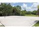 Sandy volleyball court surrounded by lush greenery, ideal for outdoor recreation and community fun at 12679 Sagewood Dr, Venice, FL 34293