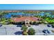 Grand clubhouse with parking and lake views, perfect for community gatherings at 13309 Ipolita St, Venice, FL 34293