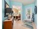 Bright foyer with tile flooring and view into a home office at 13309 Ipolita St, Venice, FL 34293