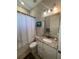 The bathroom includes a toilet, shower, and vanity with granite countertops at 13652 Classico Ct, Venice, FL 34293
