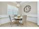 Cozy breakfast nook with round table and a chandelier at 13652 Classico Ct, Venice, FL 34293