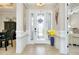 Bright foyer featuring a decorative glass front door and neutral decor at 13652 Classico Ct, Venice, FL 34293