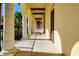Elegant hallway with classic arches, lighting, and neutral colors leading to residences at 13652 Classico Ct, Venice, FL 34293