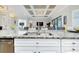 Kitchen island featuring granite countertops and sink at 13652 Classico Ct, Venice, FL 34293