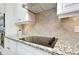 Kitchen with a smooth cooktop and granite countertops at 13652 Classico Ct, Venice, FL 34293