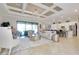 Open-concept living room featuring tile floors and kitchen view at 13652 Classico Ct, Venice, FL 34293