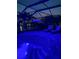 Private pool and hot tub offer evening relaxation with beautiful lake view and lounge chairs at 13652 Classico Ct, Venice, FL 34293