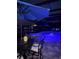 Charming outdoor poolside area with a table, chairs, and ambient lighting, creating a magical evening setting at 13652 Classico Ct, Venice, FL 34293