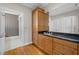 Bathroom with a granite countertop and wooden cabinets at 14 Grouper Hole Dr, Boca Grande, FL 33921