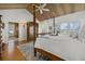 Light-filled bedroom with wood ceiling and shuttered windows at 14 Grouper Hole Dr, Boca Grande, FL 33921