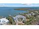 Stunning waterfront home featuring lush landscaping, a private dock, and serene water views at 14 Grouper Hole Dr, Boca Grande, FL 33921
