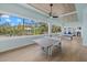 Spacious game room featuring a ping pong table, pool table, and a wall of windows offering scenic views at 14 Grouper Hole Dr, Boca Grande, FL 33921