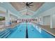 Gorgeous indoor pool with a wood plank ceiling and abundant natural light at 14 Grouper Hole Dr, Boca Grande, FL 33921