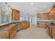 Open-concept kitchen with custom cabinetry, stainless steel appliances, granite countertops, and a seamless flow at 14 Grouper Hole Dr, Boca Grande, FL 33921