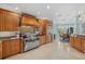 Spacious kitchen featuring custom wood cabinets, granite countertops, and stainless steel appliances at 14 Grouper Hole Dr, Boca Grande, FL 33921
