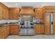 Gourmet kitchen showcasing custom wood cabinetry, a professional-grade range, and granite countertops at 14 Grouper Hole Dr, Boca Grande, FL 33921