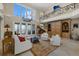 Bright living room with high ceilings, water views, a grand piano, and access to the balcony at 14 Grouper Hole Dr, Boca Grande, FL 33921