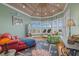 Cozy sitting area with an abundance of natural light and decorative rug at 14 Grouper Hole Dr, Boca Grande, FL 33921
