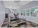 Bright and well-equipped home workout room, with windows to enjoy the water views at 14 Grouper Hole Dr, Boca Grande, FL 33921