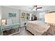 Bedroom featuring a ceiling fan, a window overlooking a green exterior, and a work desk at 150 Fiesole St, Venice, FL 34285