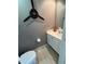 Modern half bathroom with a unique fan decoration at 1569 Napoli W Dr, Sarasota, FL 34232