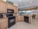 Well-equipped kitchen featuring modern appliances, ample cabinet space, and granite countertops at 162 Treviso Ct, North Venice, FL 34275