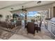 Spacious screened lanai with comfortable seating, an outdoor dining area, and a view of the pool at 162 Treviso Ct, North Venice, FL 34275