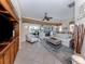 Spacious living room featuring tile flooring, ceiling fan and sliding doors to a private patio at 162 Treviso Ct, North Venice, FL 34275