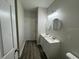 Bathroom features double sinks with white cabinets and modern lighting at 17370 Cape Horn Blvd, Punta Gorda, FL 33955