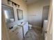 Bathroom with double sink vanity, tile floors, and modern fixtures at 17370 Cape Horn Blvd, Punta Gorda, FL 33955
